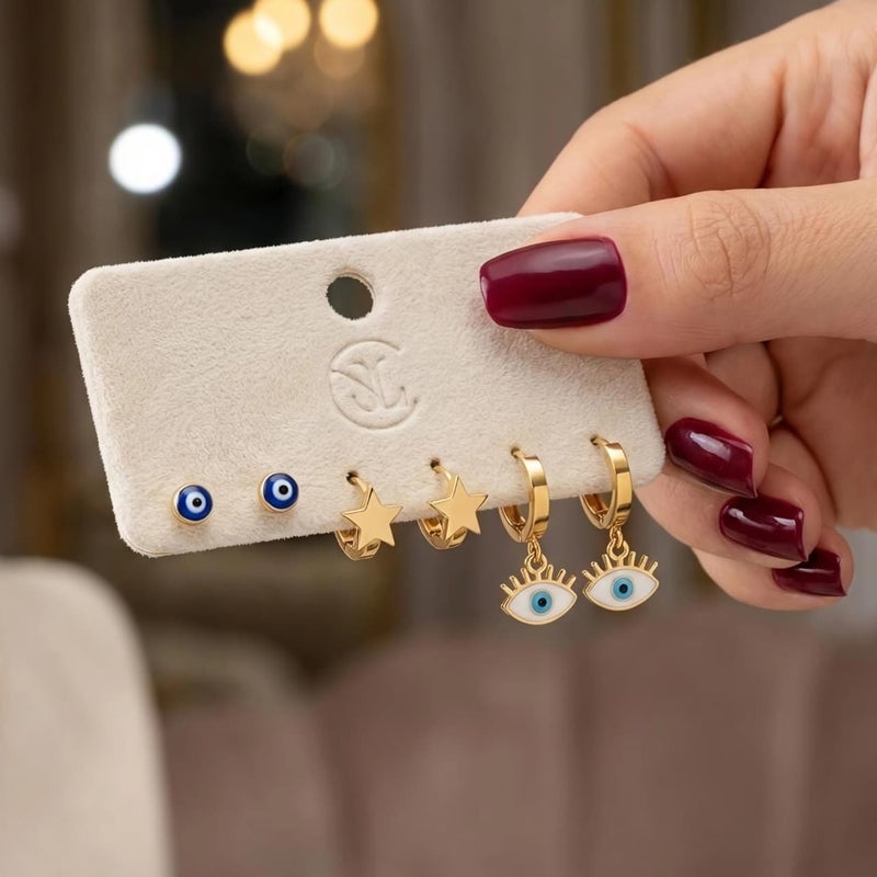 طقم ٣ أزواج حلقان ذهبي مميز: بريمة العين الزرقاء، النجمة الذهبية، وعين الرموش البيضاء. من الستانلس ستيل المقاوم للصدأ، تشكيلة تجمع بين الرقة والفخامة. - Image 4